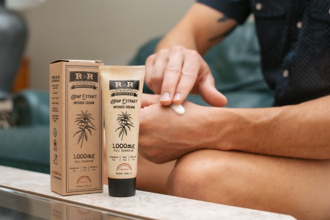 someone applying cbd cream