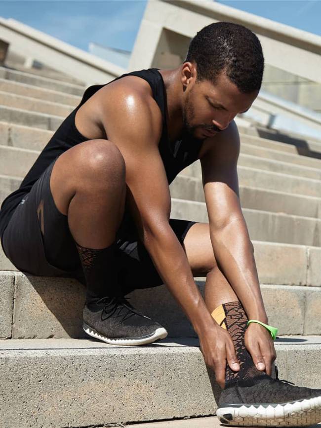 Someone rubbing a sports injury in pain