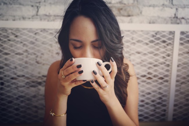 A women sipping coffee