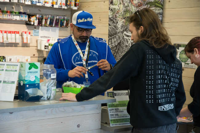 Budtender with a customer