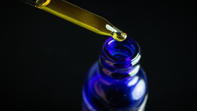 a blue bottle of CBD tincture