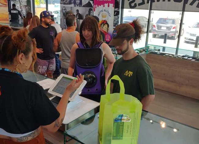 People standing in line to pick up their judge kits at a dispensary
