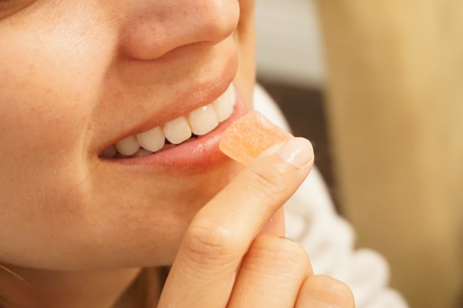 Someone eating a gummie