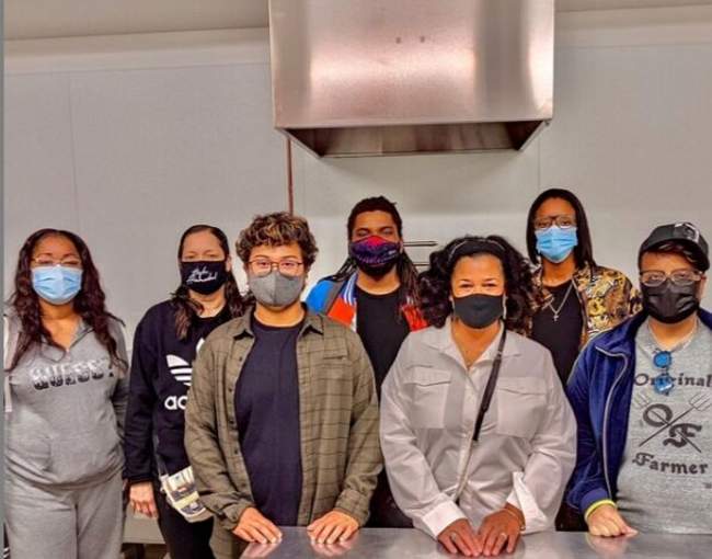 People grouped together with masks on