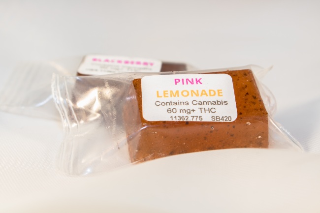 Two cannabis gummies packaging with their THC mg listed