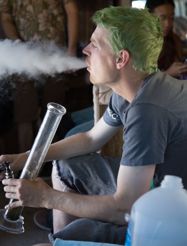 Person smoking weed out of a bong