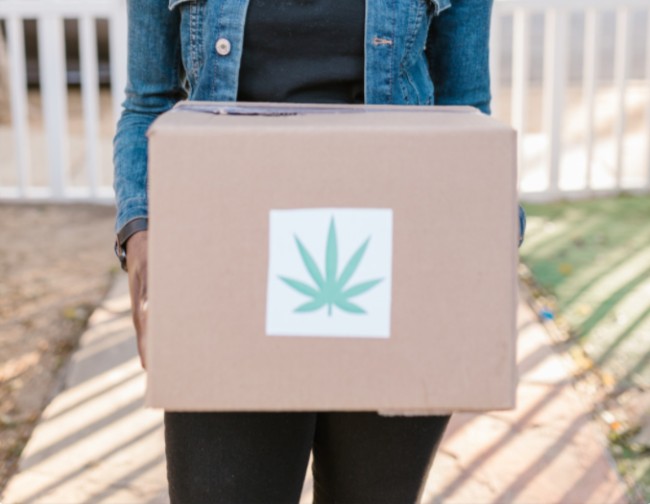 Someone delivering marijuana in a box