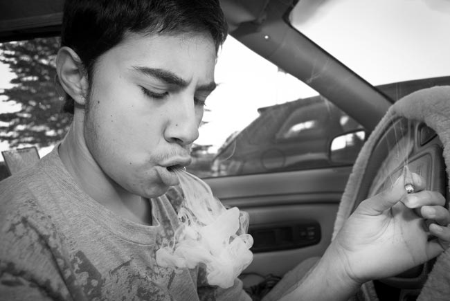 Someone hotboxing a joint in a car