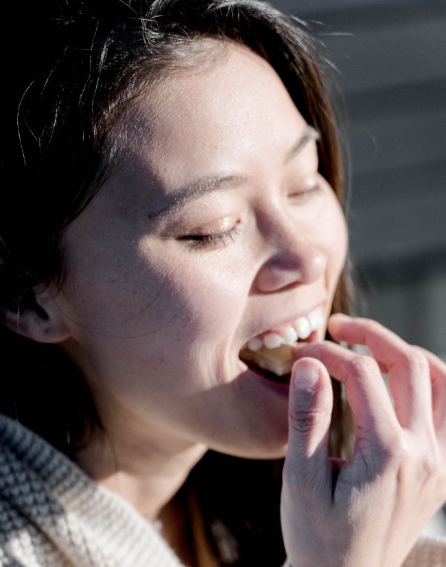 A women eating an edible